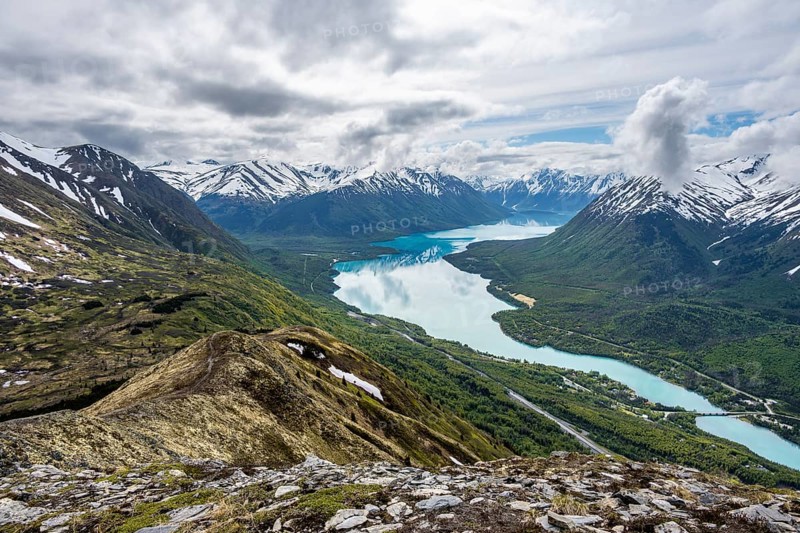 View of snowy mountains and turquoise lake Kenai Lake, Slaughter Ridge Trail, Cooper Landing, Kenai Peninsula, Alaska, USA