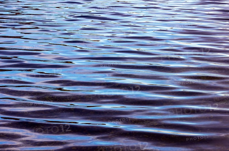 Moving water surface with waves at Mondsee, Salzkammergut, Upper Austria, Austria