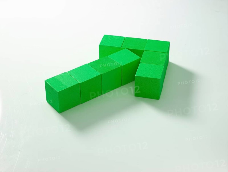 9 green wooden cubes against a white background
