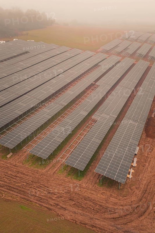 Foggy fields with solar panels, highlights rural and sustainable energy production, energy transition, construction of PV open space, Baden-Württemberg, Germany