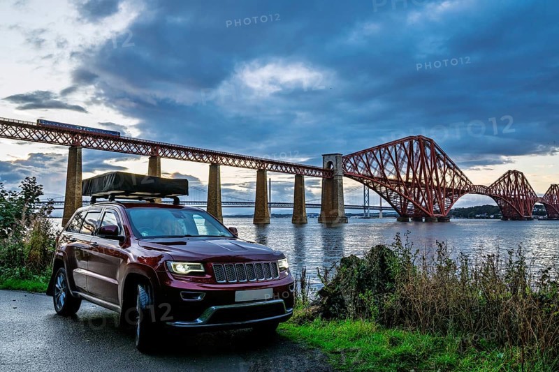 4x4 car trip with roof tent in Forth Bridge, Queensferry Crossing, Forth Estuary, Scotland, United Kingdom