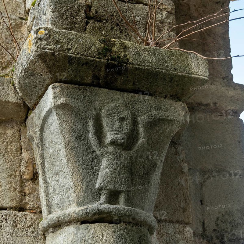 St Cyr and St Julitte's Church, roman church of Escurolles. Atlas sculpture. Allier department, Auvergne Rhone Alpes, France