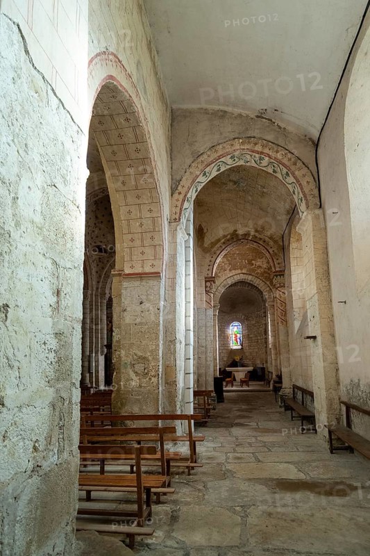 St Cyr and St Julitte's Church, roman church of Escurolles. North aisle with quarter-circle vault and pointed arches. Allier department, Auvergne Rhone Alpes, France