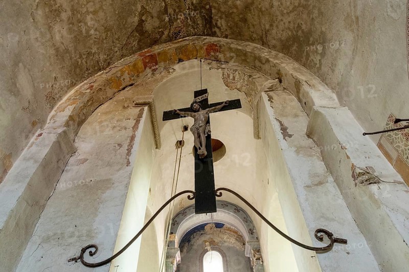 Maerier village. Low angle shows the architecture and crucifix hanging within the St Saturninus Church, Allier, Auvergne Rhone Alpes, France. Europe