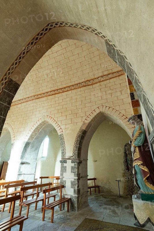 Painted church St Aignan's Church of Begues. Ogival arcades. Allier department. Auvergne Rhone Alpes. France. Europe
