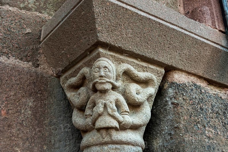 Sculptural details on the porch of the Romanesque church in Azerat village, Haute Loire, Auvergne-Rhone-Alpes, France