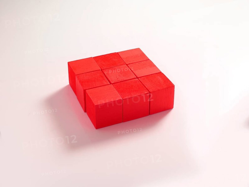 9 red wooden cubes against a white background