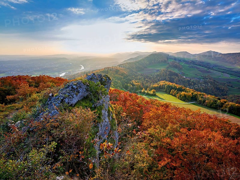 View of an autumnal forest from the Gisliflue, behind the Jura foothills with Wasserfluh and Strihen, Talheim, Canton, Aargau, Switzerland