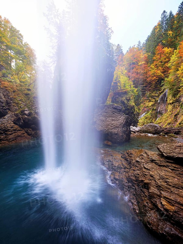 Waterfall mountain list in autumn-colored surroundings, Linthal, Klausenpass, Canton of Glarus, Switzerland