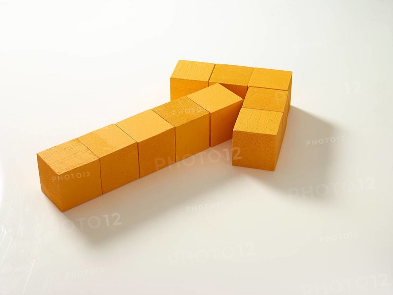 10 yellow wooden cubes against a white background