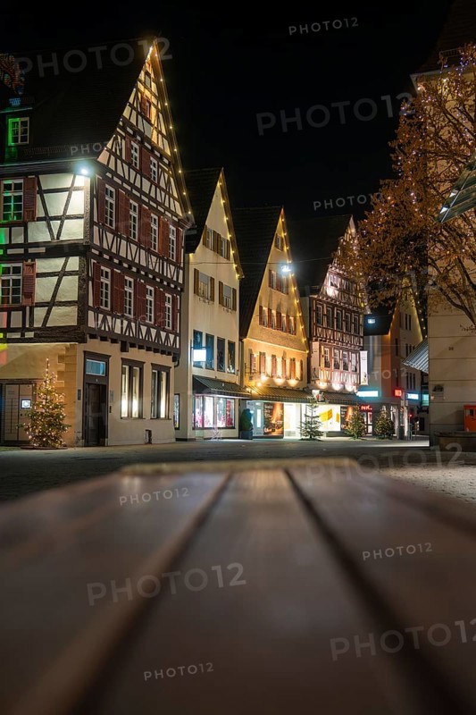 Illuminated half-timbered houses line the Old Town Street at night and create a festive atmosphere, Nagold, Calw District, Black Forest, Germany