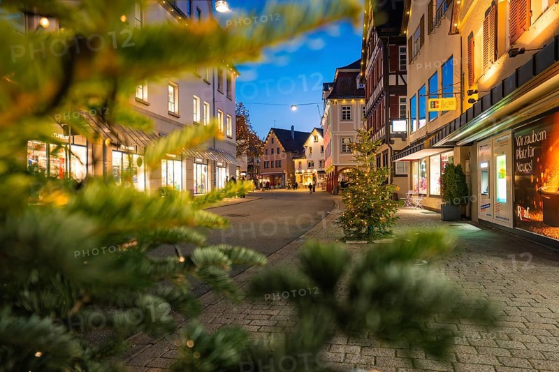 Pedestrian zone with illuminated fir trees, shopping atmosphere in the evening, Nagold, Calw district, Black Forest, Germany
