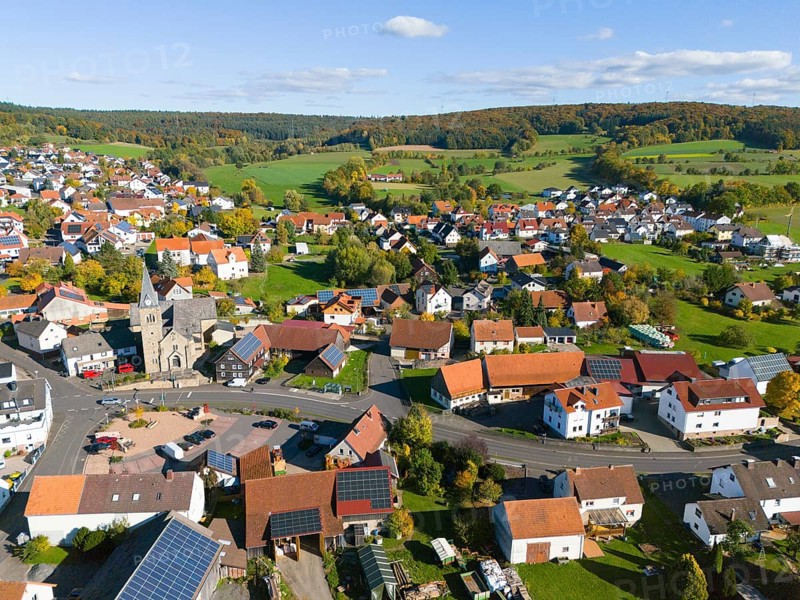 Bird's-eye view of village with many houses in hilly landscape, aerial view, Niederkalbach, Kalbach municipality, Fulda district, Hessian Rhön nature park Park, Hesse, Germany