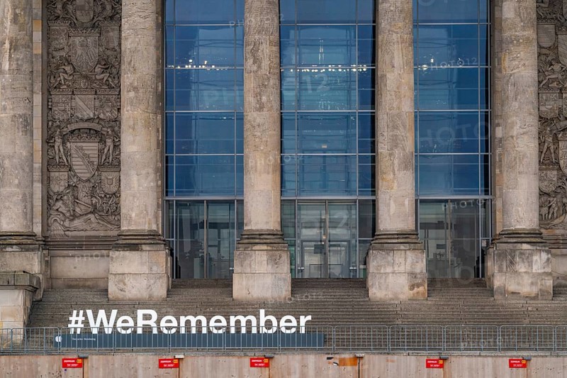 Construction fences and letters with the hashtag We Remember in memory of the victims of fascism and National Socialism in front of the German Bundestag in the Reichstag, Platz der Republik, Berlin, Germany