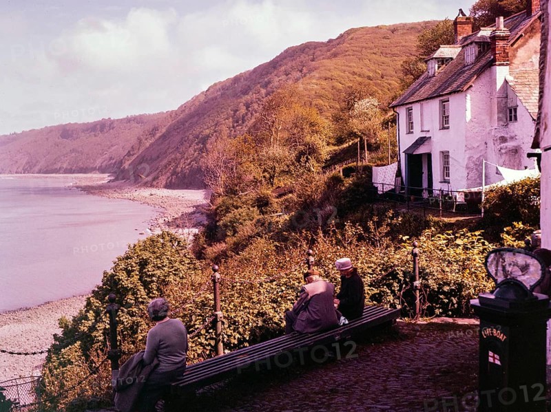View of coastline with wooden cliffs from the harbour at Clovelly, north Devon, England, UK 1960s
