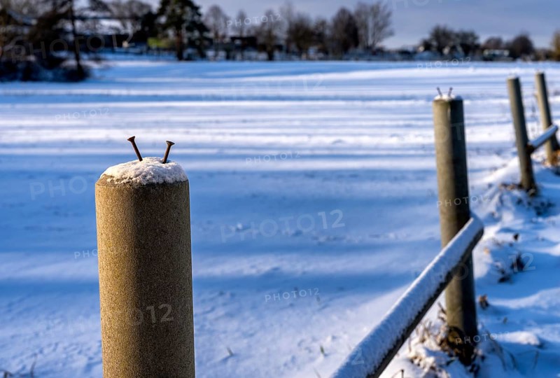 Detailed photo, concrete fence post on a field in Berlin-Lübars, Germany