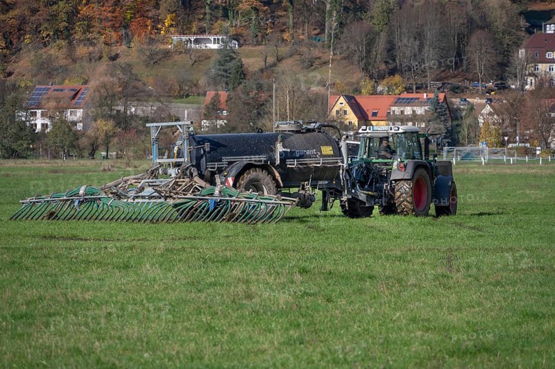 Farmer fertilizing his meadows by tow hose, Eschenbach, Middle Franconia, Bavaria, Germany