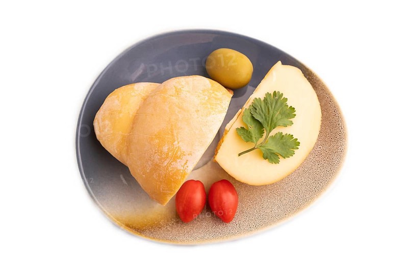 Smoked Mozzarella cheese, with tomatoes and olives isolated on white background, top view, flat lay, copy space
