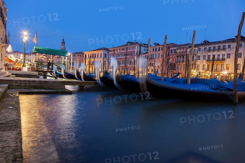 Gondolas and palaces on the Grand Canal at night, Venice, Veneto, Italy