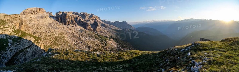 Panorama, view of rocky mountain peaks of the Brenta Mountains in the evening light, sunset over the Adamello Group, mountain landscape on the Grosté Plateau, Brenta-Adamello Natural Park, Trentino, Italy