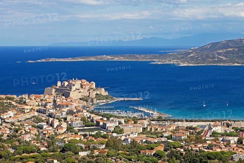 View of Calvi Citadel and Calvi Bay, in the background Cap Corse, Haute-Corse Department, Balagne, Corsica, France