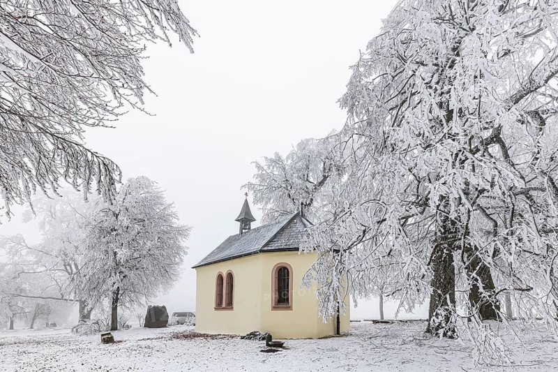 Schoenstatt Chapel Ennabeuren with hoarfrost in winter. Tourist attraction in the Swabian Jura. Heroldstatt, Baden-Württemberg, Germany