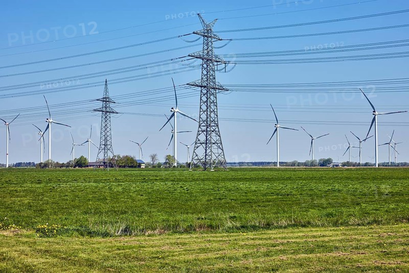 Wind turbines, high-voltage pole, high-voltage line, meadows, trees, Stadionstraße, Risum-Lindholm, Nordfriesland district, Schleswig-Holstein, Germany