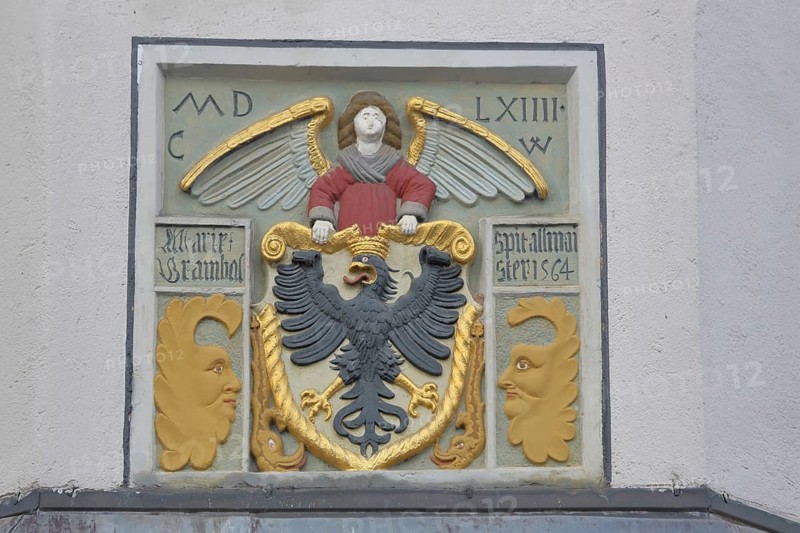 City coat of arms at the former Holy Spirit Hospital building built in 1564, inscription, year, eagle figure, heraldic animal, care center, Bürgerheim, Nördlingen, Bavaria, Germany