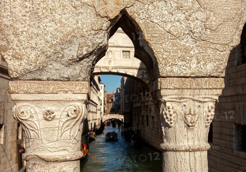 View of the Bridge of Sighs through the railing of the Ponte della Paglia, Venice, Veneto, Italy