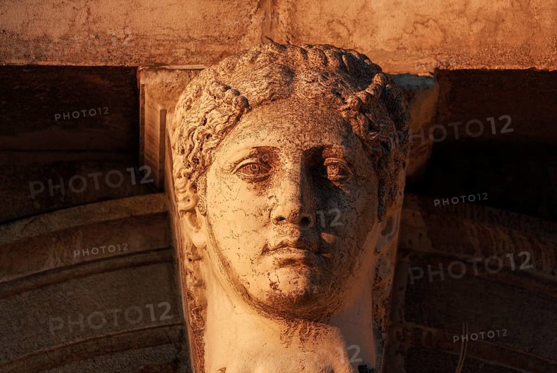 Head of a woman on the colonnade of the Biblioteca Nazionale Marciana (National St Mark's Library) in the Piazzetta, Venice, Veneto, Italy