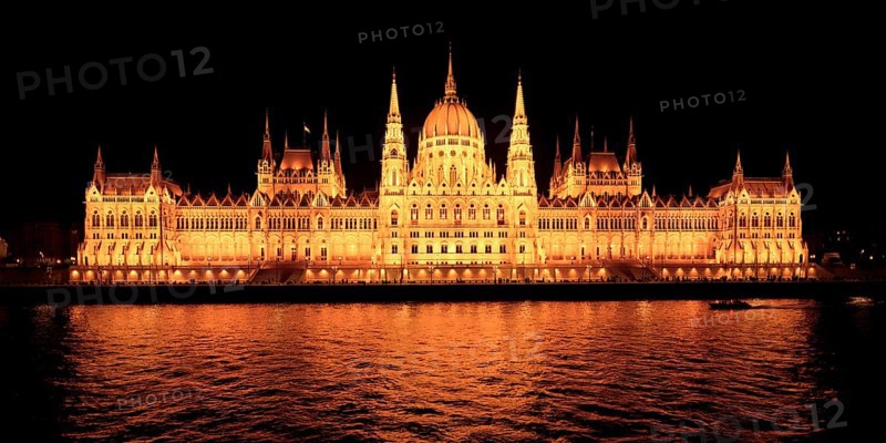 Hungarian parliament building viewed from the Danube River at night, Budapest, Hungary