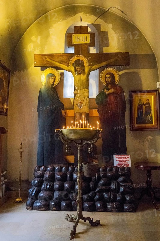 Depiction of the Crucifixion with Burning Candles in a Dark, Silent Church Room, Bodbe Monastery, Sighnaghi, Signagi, Kakheti Province, Greater Caucasus, Georgia, Western Asia