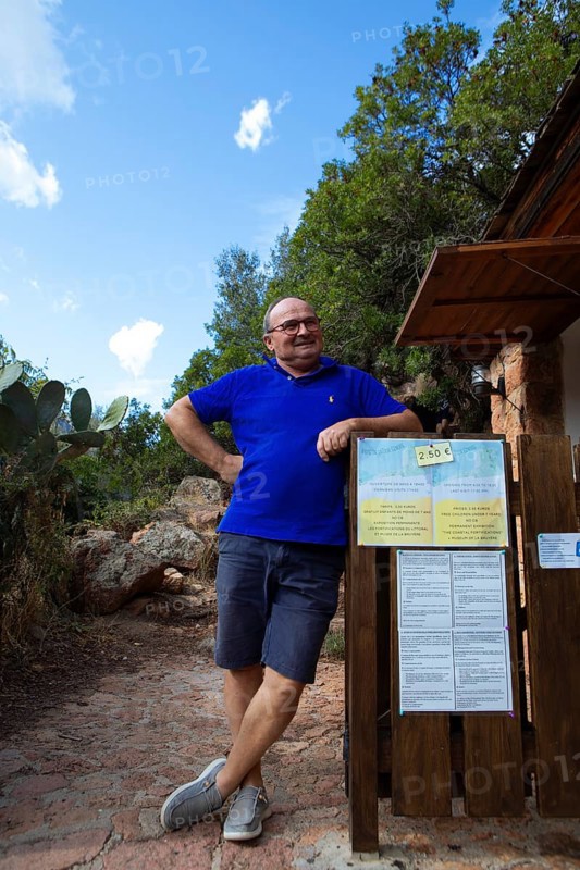 Corsican man, 67 years old, checks the entrance to the Genoese Tower of Porto, Ota, west coast of Corsica, Corse-du-Sud, Corsica, France