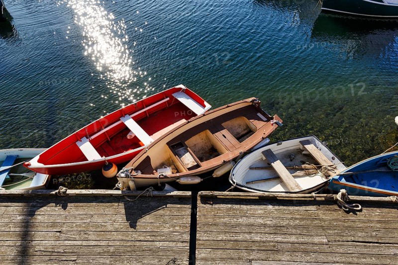 Small rowing boats moored on a wooden pier, sunny weather, view from above, Bradley Wharf, Bearskin Neck, Rockport, Cape Ann, Massachussets, New England, USA