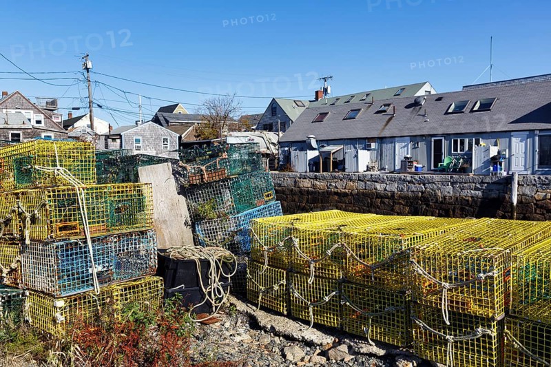Stacked lobster traps, colorful lobster baskets on the wharf, traps, traditional buildings, Bradley Wharf, Bearskin Neck, Rockport, Cape Ann, Massachussets, New England, USA