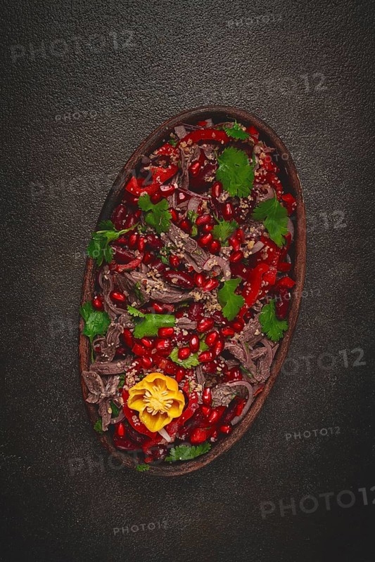 Georgian salad Tbilisi, boiled beef, with red beans and onions, sweet pepper, walnut and pomegranate, homemade, no people