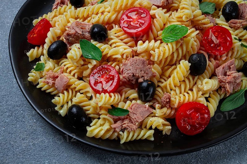 Tuna salad, fusilli pasta, olives and cherry, olive oil, homemade