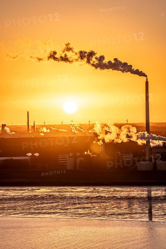 Kronos Titan chemical plant, one of the world's leading manufacturers of titanium dioxide, in Nordenham, Bremerhaven, sunset, Germany