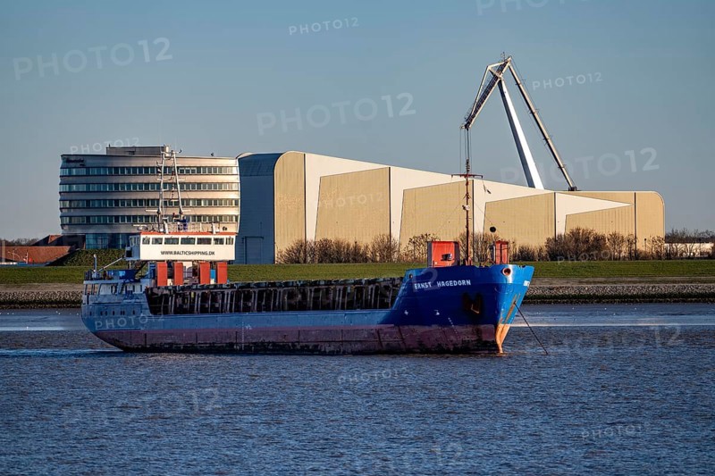 Danish cargo ship Ernst Hagedorn, anchored in the mouth of the Weser, in the background the Fraunhofer Institute for Wind Energy Systems IWES, left, Bremerhaven, Germany