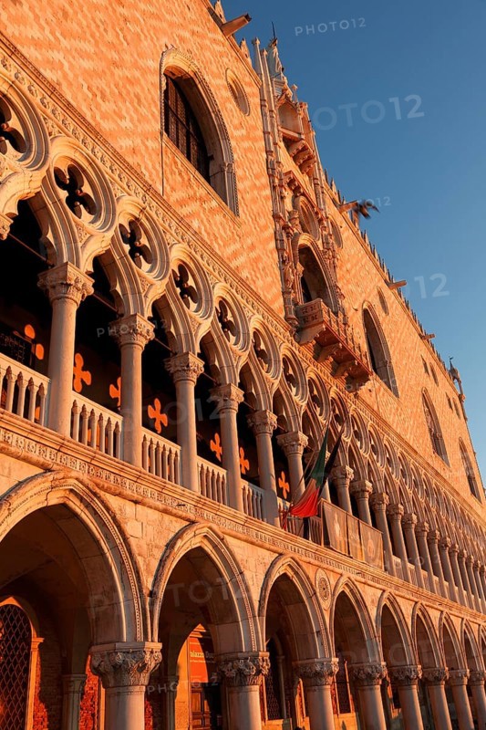 Sun rays at sunrise on the façade of the Doge's Palace, Venice, Veneto, Italy