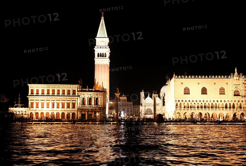 Illuminated Piazzetta San Marco with the granite columns, the Biblioteca Nationale Marciana, the Doge's Palace, the Basilica San Marco, the Campanille, San Marco, Venice, Veneto, Italy