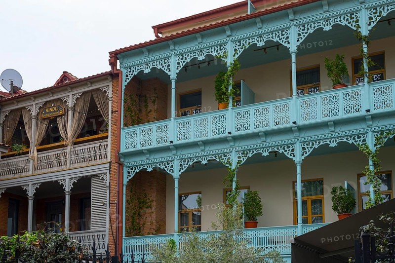 Traditional Caucasian architecture with decorated balconies and wooden railings decorated with plants, Tbilisi, Tbilisi, Georgia