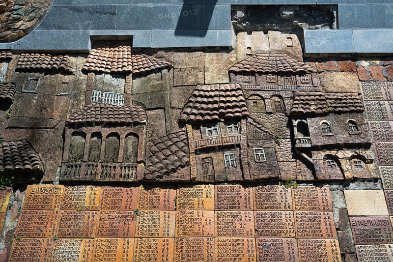 Stone relief with architectural details of traditional houses on a wall, commemoration of World War II, Sighnaghi, Signagi, Kakheti province, Greater Caucasus, Georgia, Western Asia