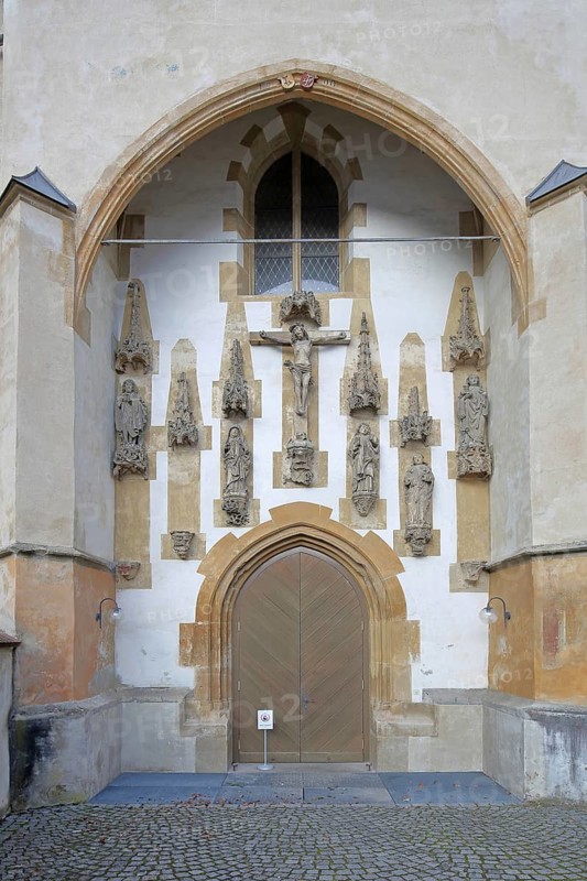 Church portal with crucifix and figures, monastery church decorations built in the 15th century, Benedictine monastery, church door, Blaubeuren, Swabian Jura, Baden-Württemberg, Germany