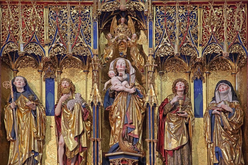 Late Gothic high altar by sculptor Jörg Syrlin the Younger of the Ulm School built in 1494, from left to right founder Benedict, John the Baptist, Madonna figure with baby Jesus, Saint John the Evangelist, scholastics, wood carvings, monastery church, interior view, winged altar, handicraft, work of art, decorations, figures, Benedictine monastery, Blaubeuren, Swabeburen Iberian Alps, Baden-Württemberg, Germany