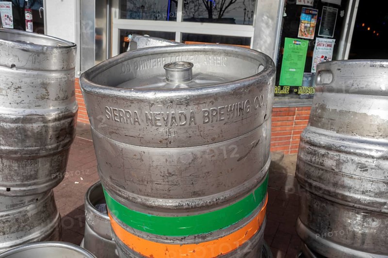 Arvada, Colorado - Empty beer kegs stacked outside Cheapskates sports bar in Olde Town Arvada