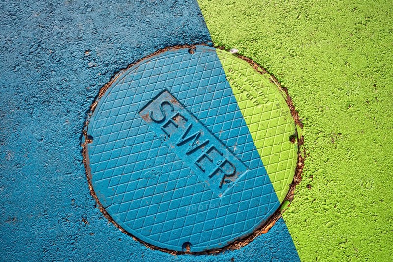 Arvada, Colorado - A brightlyl-colored manhole cover which leads to the city's sewer