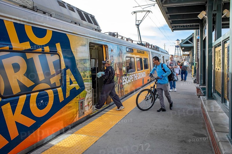 Arvada, Colorado - Passengers board Denver's light rail train system at the Olde Town Arvada station