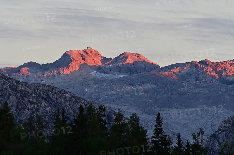 The summit of the Hochkönig with the Matrashaus in the last light at sunset, seen from the Gotzenalm, Berchtesgaden Alps on the border between Bavaria and Salzburger Land, Germany, Austria