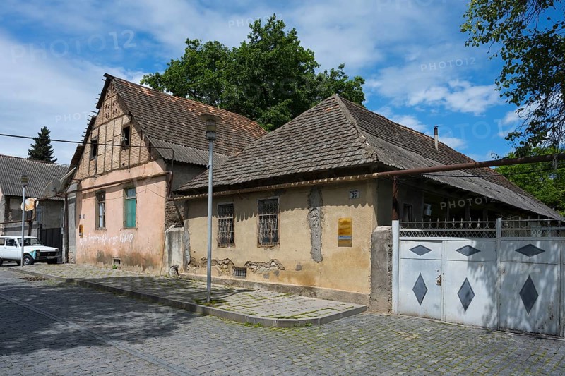 Two old houses with tiled roofs and weathered facades on a cobblestone street, traditional German residential building, Nikolaistraße 36, Bolnissi, Katharinenfeld, founded by Caucasian German settlers, Lower Kartli region, Kwemo Kartli, Georgia
